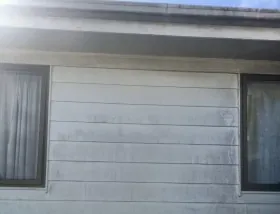 Washed weatherboards and soffit under the eaves
